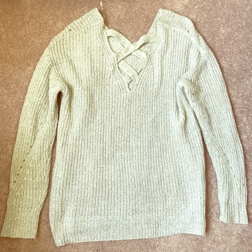 Green hued semi hi-low cross back sweater